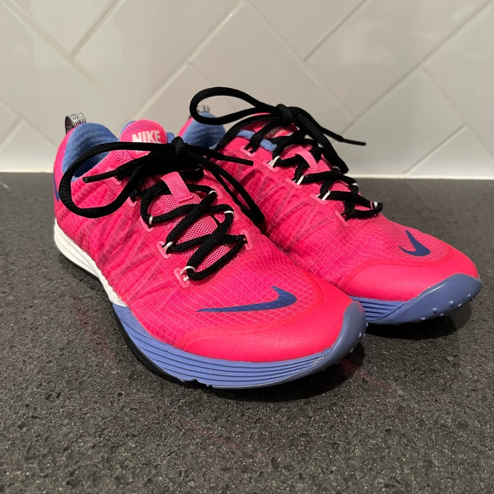 Size 6.5 hot pink running shoes. New condition, super light weight.